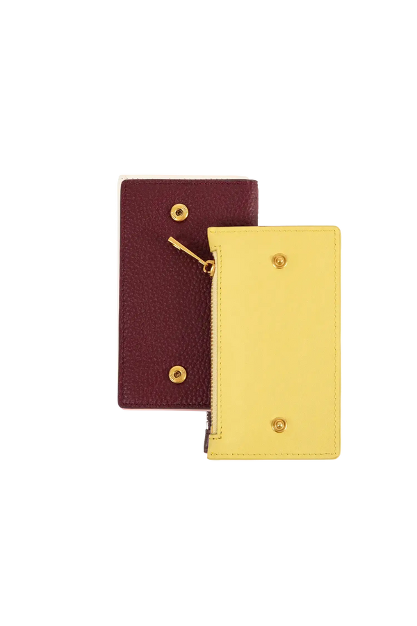 Carteira modular em couro legítimo nas cores burgundy e rosa com bolso removível prático e compartimentos internos para cartões, formato ergonômico e slim que cabe no bolso ou na bolsa sem criar volumes desnecessários.