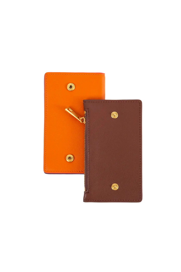 Carteira modular em couro legítimo nas cores laranja e roxo com bolso removível prático e compartimentos internos para cartões, acabamento refinado de alta qualidade, perfeito para proteger itens essenciais com sofisticação.
